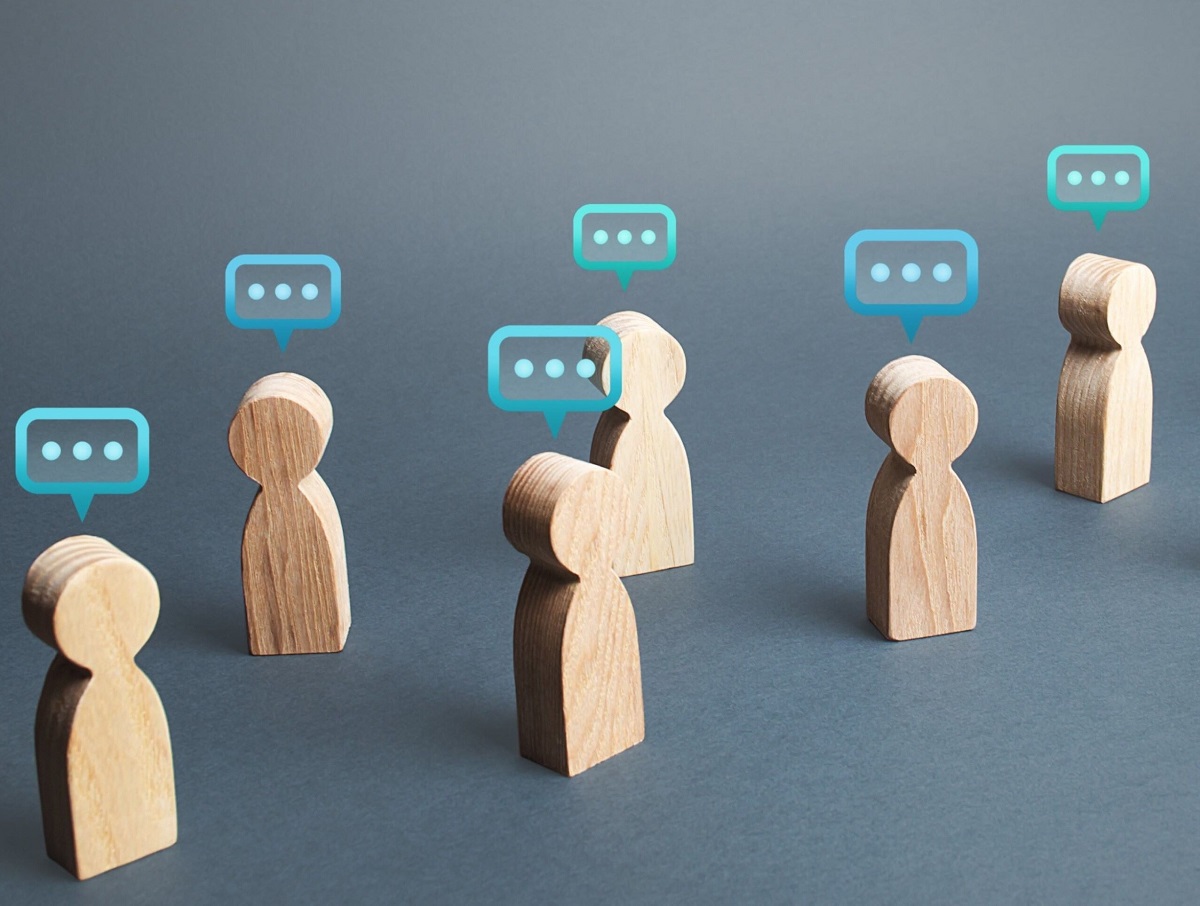 Wooden cutouts depicting people talking