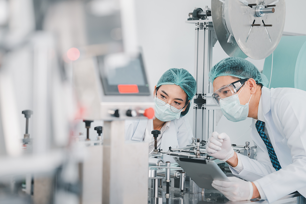 Scientists inspecting equipment
