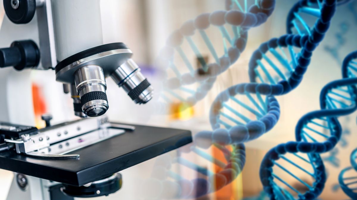 Laboratory microscope overlaid with a DNA double helix graphic